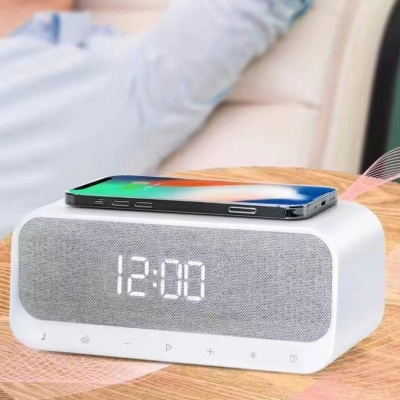 Multifunctional alarm clock with USB and wireless smartphone charger, built-in radio and Bluetooth speaker